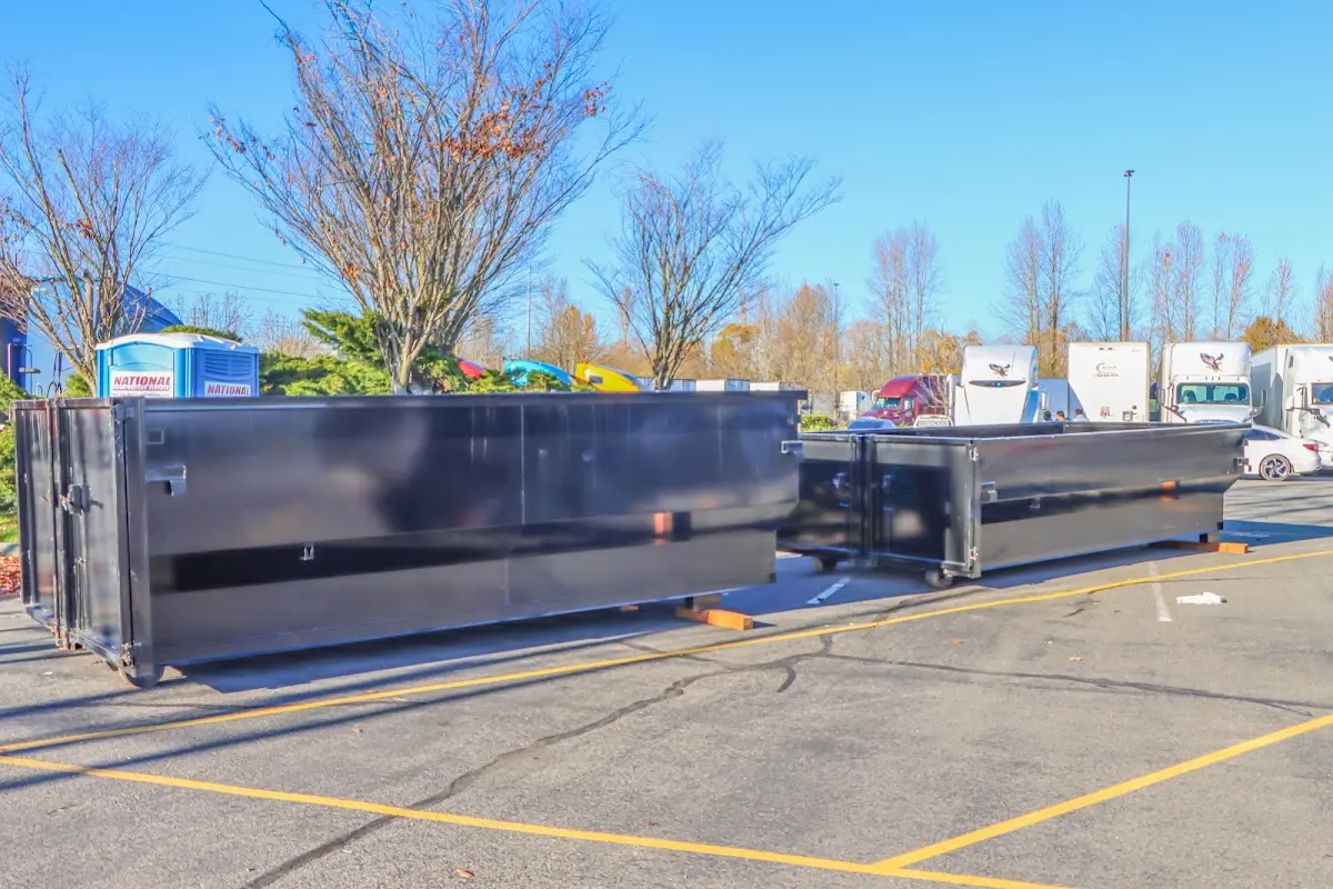 Professional dumpster rental service with roll-off container on residential driveway in Swatara